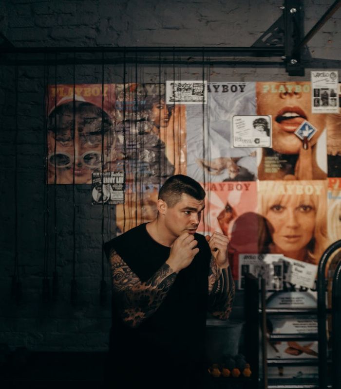 Strong man focused on functional movements in a modern atmospheric gym